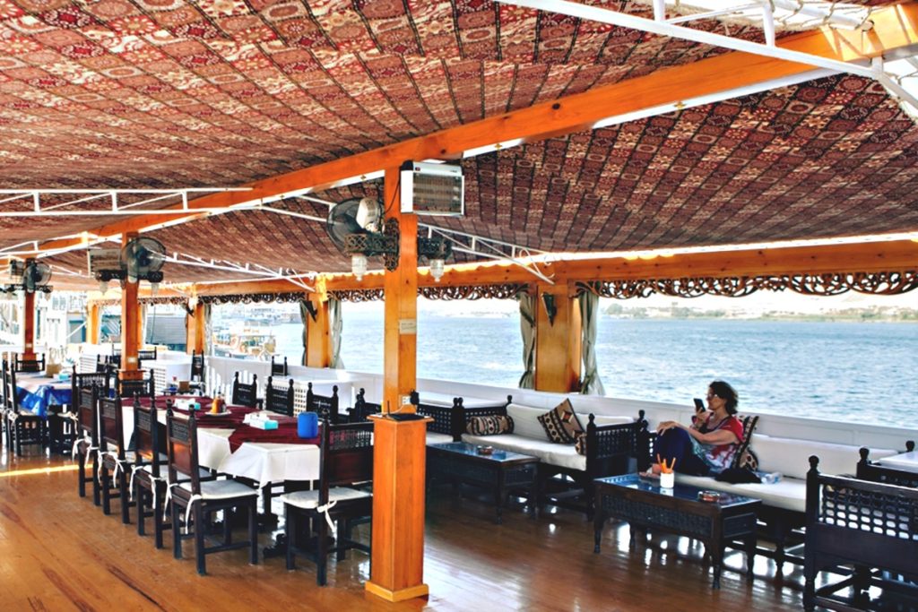 Sunset dining on deck of Dahabiya Nile Cruise